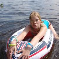 Cutie sonya plays on her tube on the lake teasing her boobies and tiny teen ass