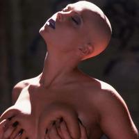 Bald girl in bustier shows off