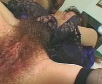 Lustful hairy dark-haired slut sucking two cocks simultaneously