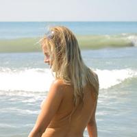 Totally nude Lana showing tight body on the beach