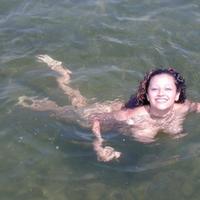 Talia goes skinny dipping and tans nude