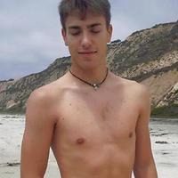 Twink boy on the beach masturbating