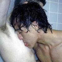 2 young men kissing and playing in the shower