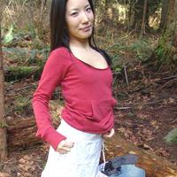 Almond Tease outdoors changing into mini skirt