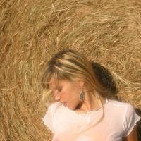 Teen girl in a field of hay