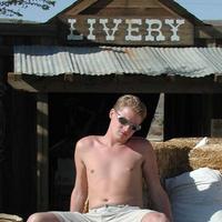 Cute blond boy goes wild west and gets naked outside.