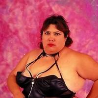 Dominatrix BBW in Black Suit Posing with Whip