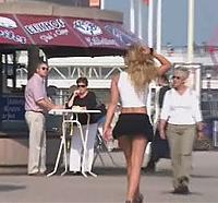 Teen girl flashing on Dutch beach