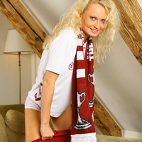 Karen stripping out of a Hearts football kit