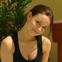 Carla enjoying the sun in a tight black top and lingerie.