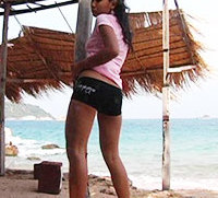 Tiny Joon sways her small hips at a beach hut