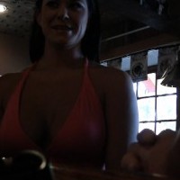 Gorgeous busty brunette, Savanna Stern, sits in the bar having drinks and flashing her pussy and then runs around outdoors with 