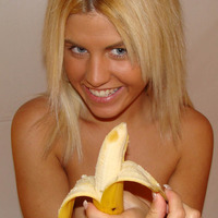 Blonde GF sucking on a big banana like it's her favorite cock