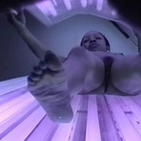 Ebony beauty gets her pussy captured on spy cam while working on her tan in a solarium.