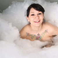 Big boobed beauty in bubble bath