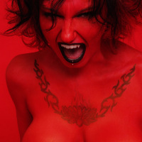 Tattooed and pierced big titty Devil girl