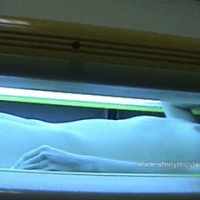 Oiling down and climbing in tanning bed NUDE