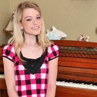 Naughty teen pianist massages her breasts and pussy