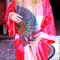 Alluring blonde teen posing her fuckable body with a nice red kimono dress