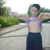Russian teen brunette undresses outdoor