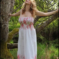 Sweet Seattle blonde with daisies in her hair flashes her curves outside.