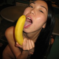 Drunk asian girlfriend with threatening banana