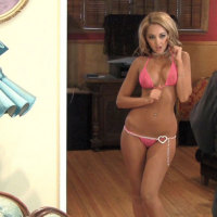 Watch as Alluring Vixen Ashley poses in a tiny little pink string bikini