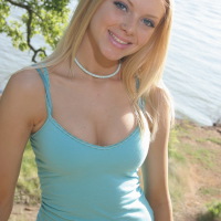 Skye Model: Cute teen Skye is by the lake as she shows off her perfect ass and teases with perky tits