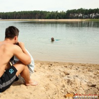 A dude nailing a hot teenage diver on the beach