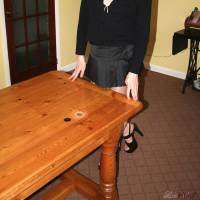 Naughty Lucimay is hog tied too wooden table