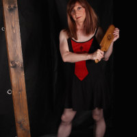 Horny Lucimay loves to give a stern spanking out with her wooden paddle.