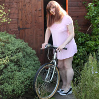 TGirl Luci takes her bike out for a spin, but ends up with her saddle up her ass and wanking in the garden