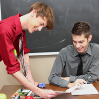 Elijah White and Max Morgan are stuck grading their students` poorly written papers!