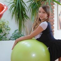 18yo Busty Buffy jumps on ball in schoolgirl uniform