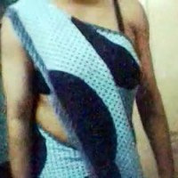 Watch this webcam tease of an womany as she does a little dancing wearing a sleeveless saree and black bra.