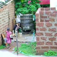 Watch this two hot Sri Lankan lady getting bath in outdoor the other girl flashing tits and butt while changing clothes.