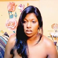 This is a video of an India housewife, named Rashmi, showing her nude body in front of a cam like a cam girl. She exposes every bit of her body curves in this video. She is not that much fair, but her assets would tempt your sexual mood a lot. She lig...