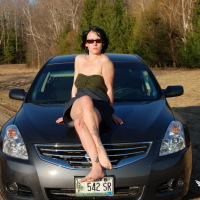 SpunkyAngels: Horny tease Sabrina shows off her tight pussy as she lifts her dress while on the hood of the car outdoors in the warm sun