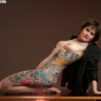 tattooed milf shows off extensive ink