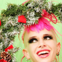 Tattooed pierced and shaved punk Christmas babe