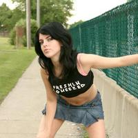 Flirty teen rollerblading in short skirt