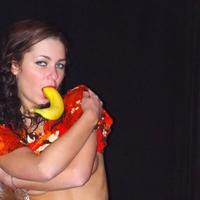 Young Russian teen plays with banana